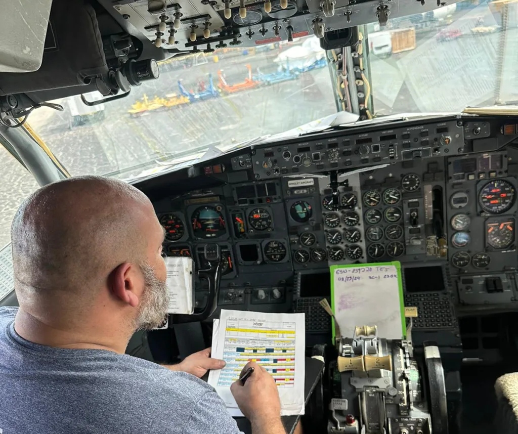 Certification test-run inside the cockpit. Recording gauge output readings.